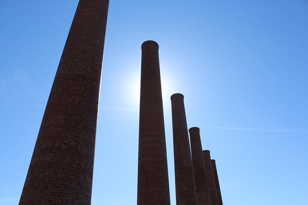 Sun blocked by one of the 12 smokestacks on the western edge of The Waterfront. Photo captured by: Andrew Niemynski