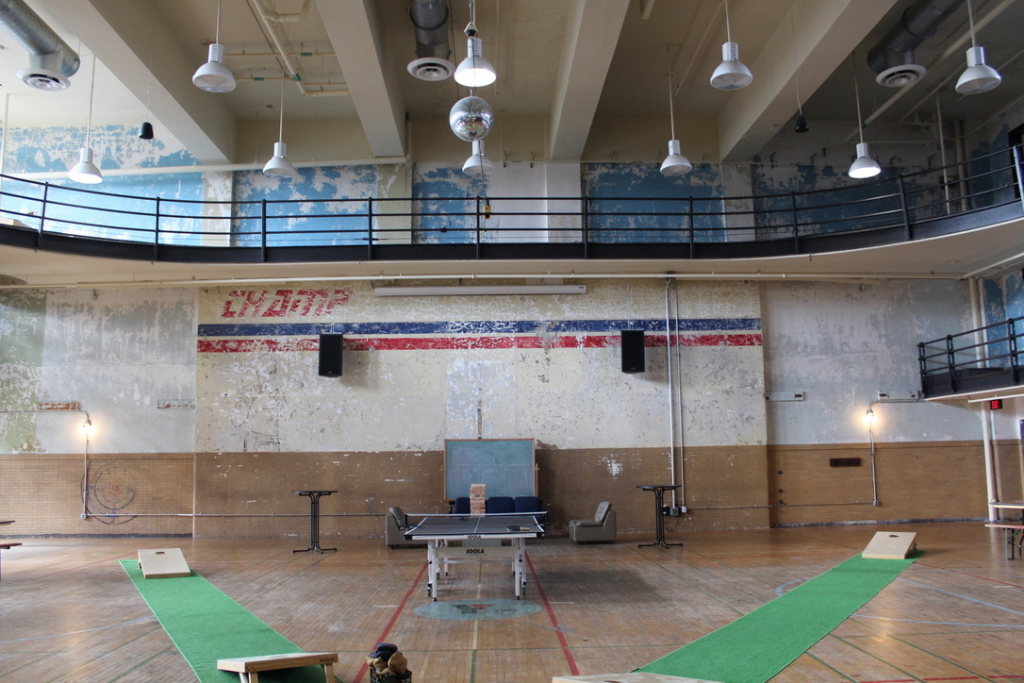 The recreation area of the Ace Hotel used to be the gym of the YMCA, complete with an indoor track. Today, it is used as an open public area and event space. Photo by Emily Meehan, 2019.