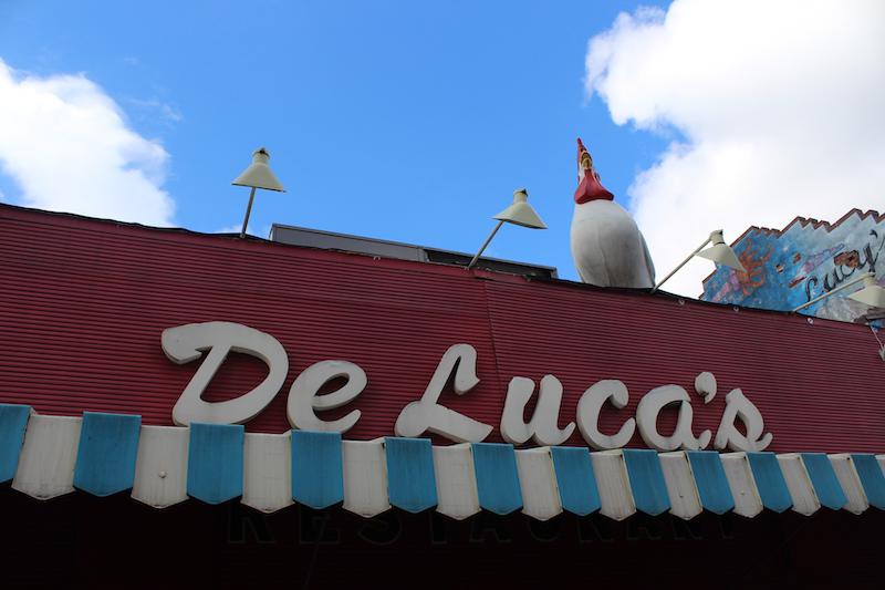 The store front to DeLuca's Diner. In this image you can see the giant chicken statue that's on the roof of their building. Photo by Kyra Moore, 2019
