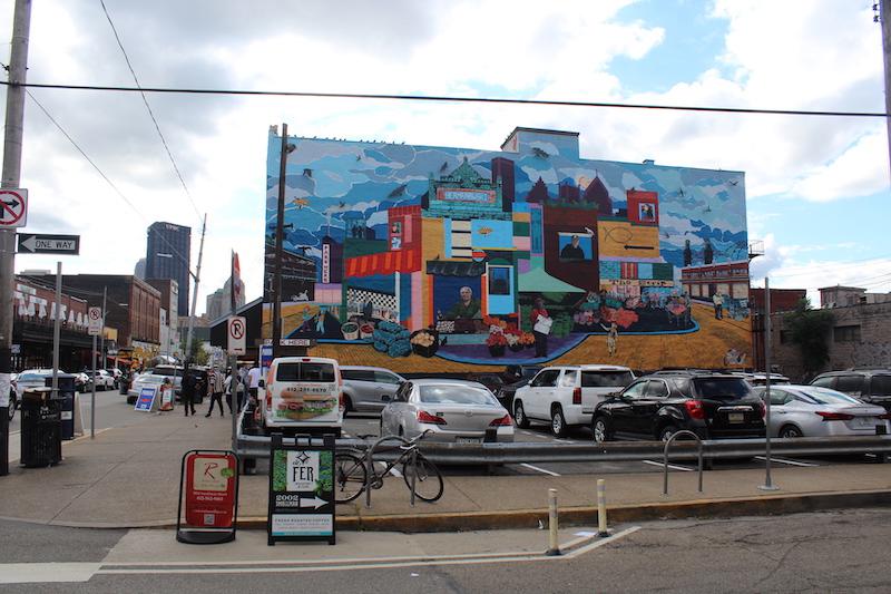 A large Mural in the middle of the Strip District, painted by Carley Parrish and Shannon Pultz. Photo by Kyra Moore, 2019
