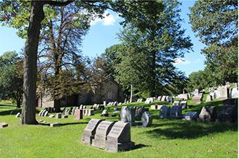 Photo by Dylan VanKirk, 2021. This shows the great number of graves that can be found in the rolling hills of the cemetery.